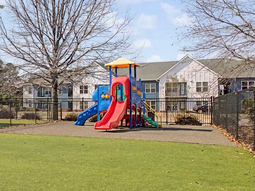 Colorful playground with slides and climbing structures