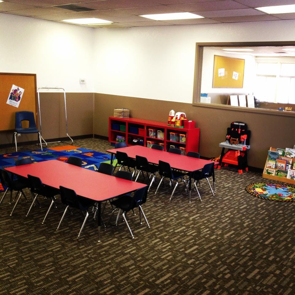 Classroom with red tables and chairs