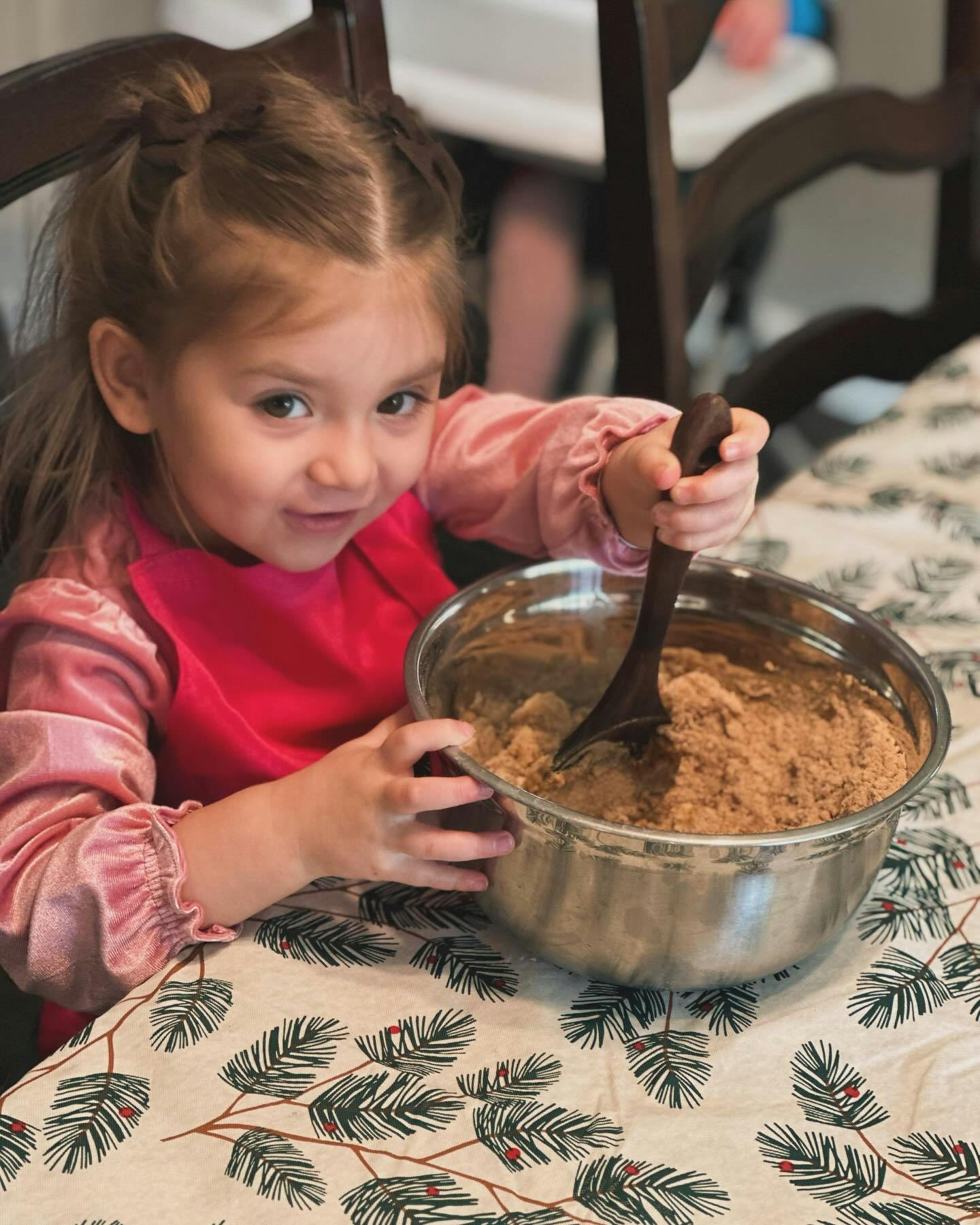 Child stirring ingredients in a bowl