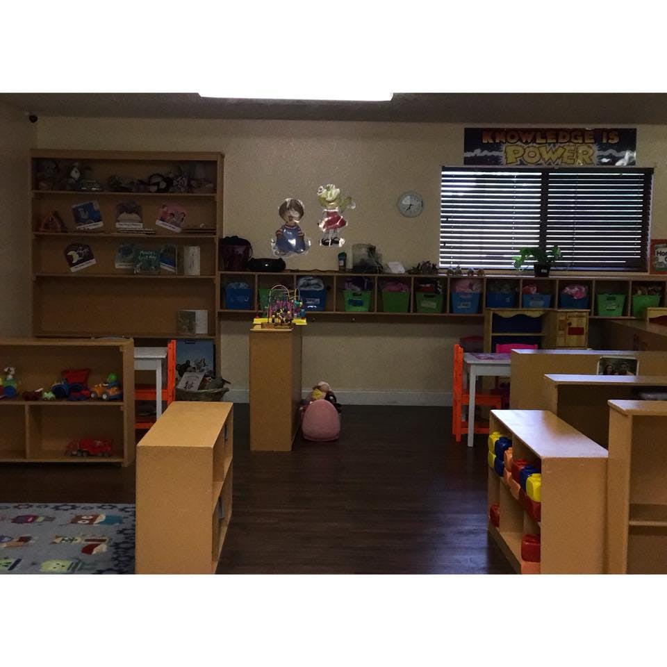 Classroom with shelves, tables, and toys