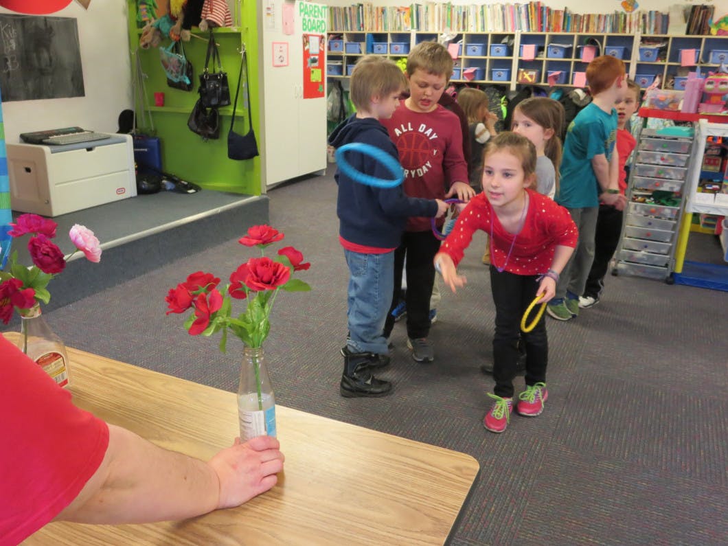 Children playing with rings in a classroom