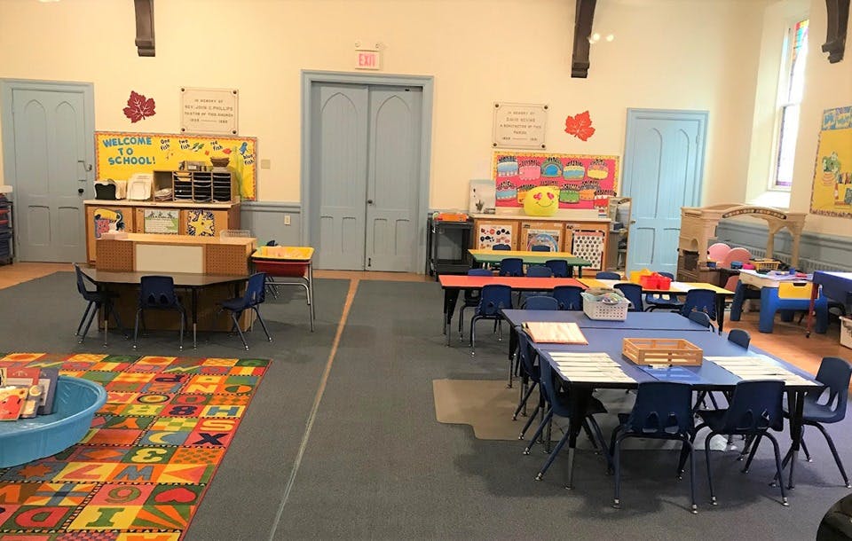 Empty classroom with tables and chairs