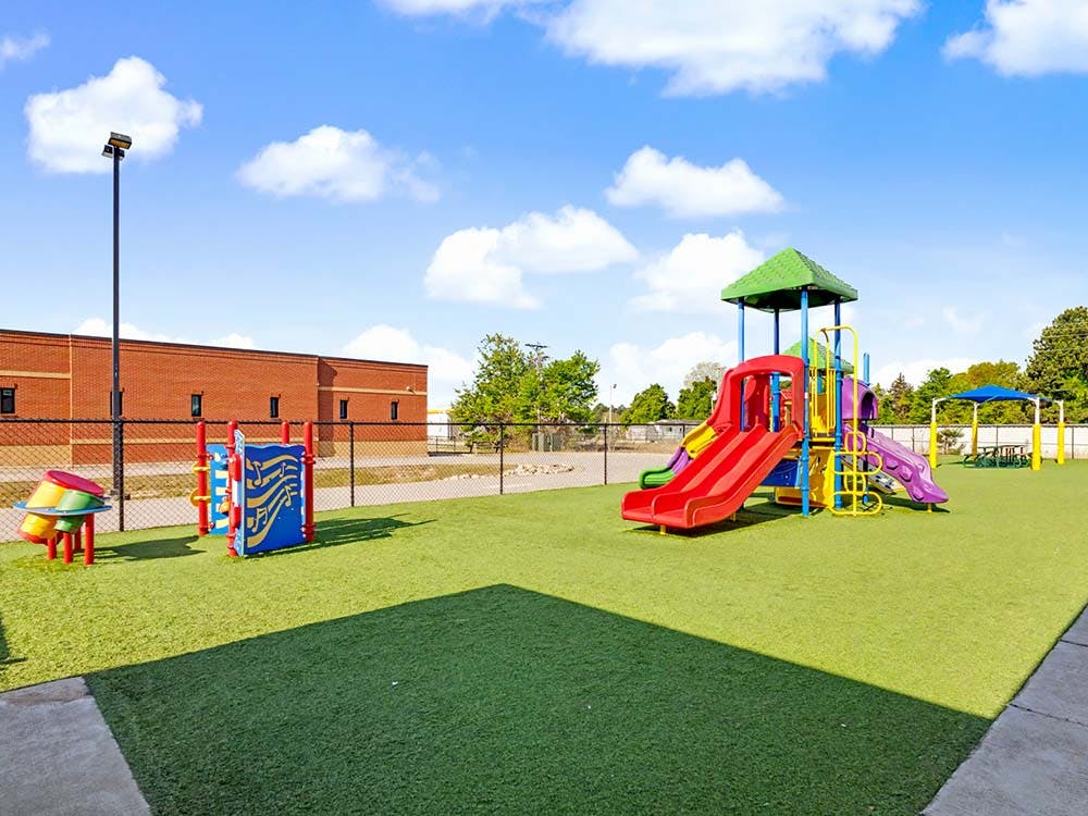 Colorful outdoor playground with slides and climbing structures