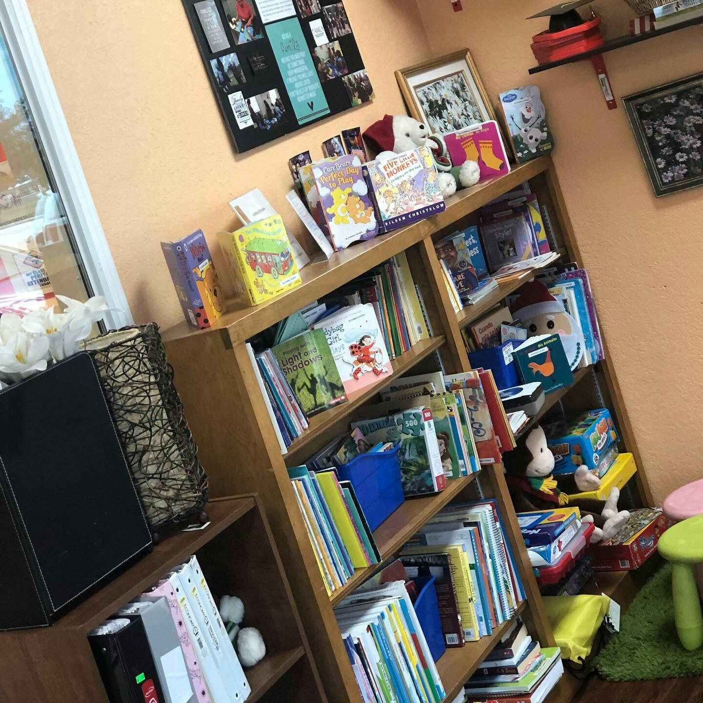 Bookshelves filled with books and toys