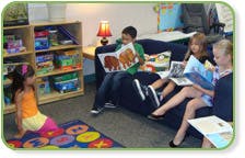 Children reading books in a classroom