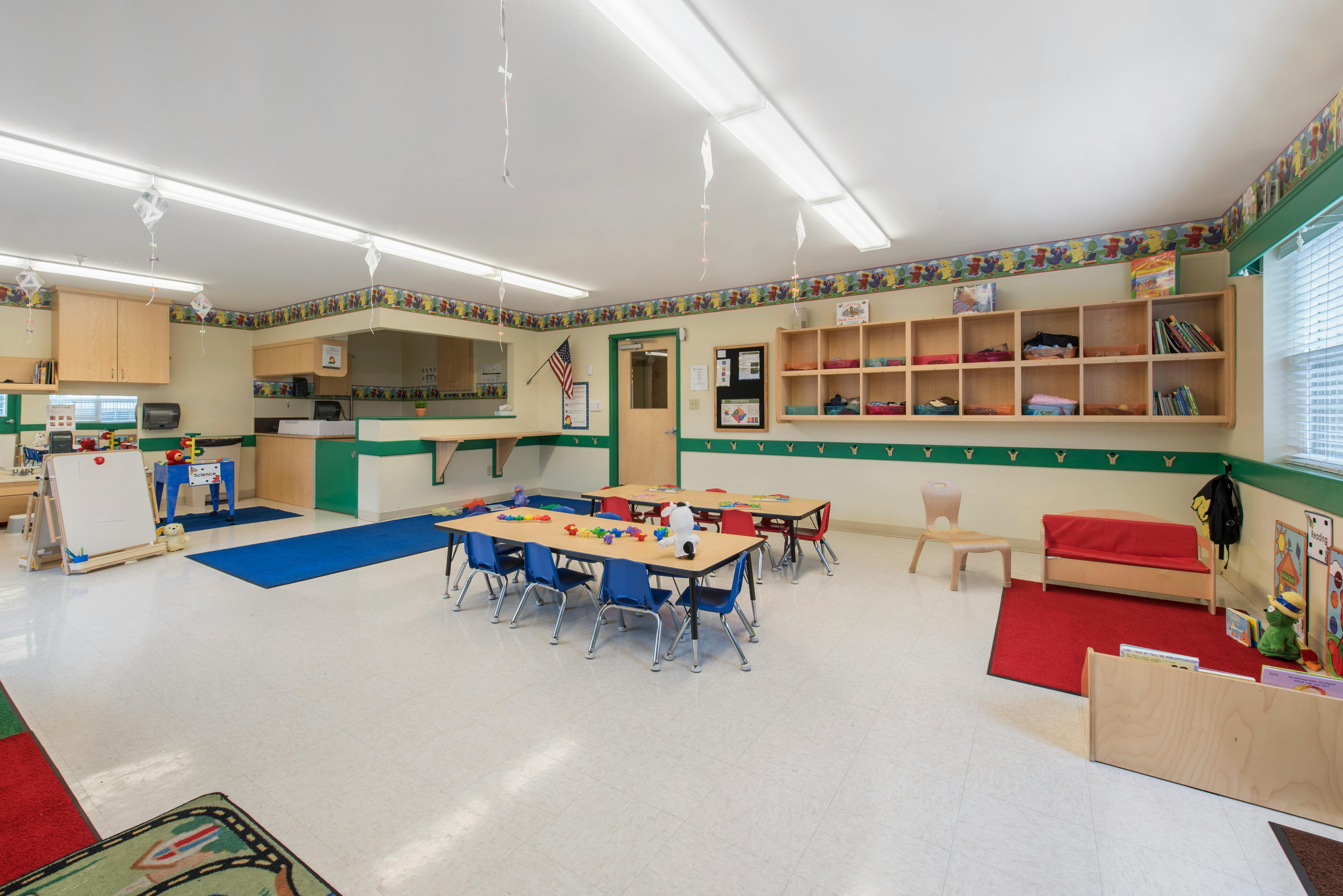 Classroom with tables, chairs, and learning materials