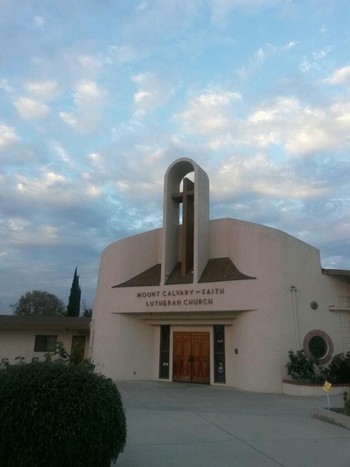Mount Calvary-Faith Lutheran Church building with a cross