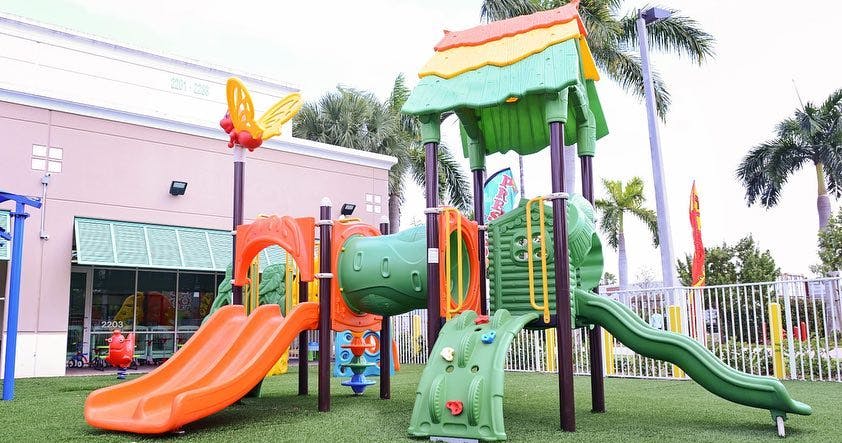 Playground with multiple slides and climbing structures