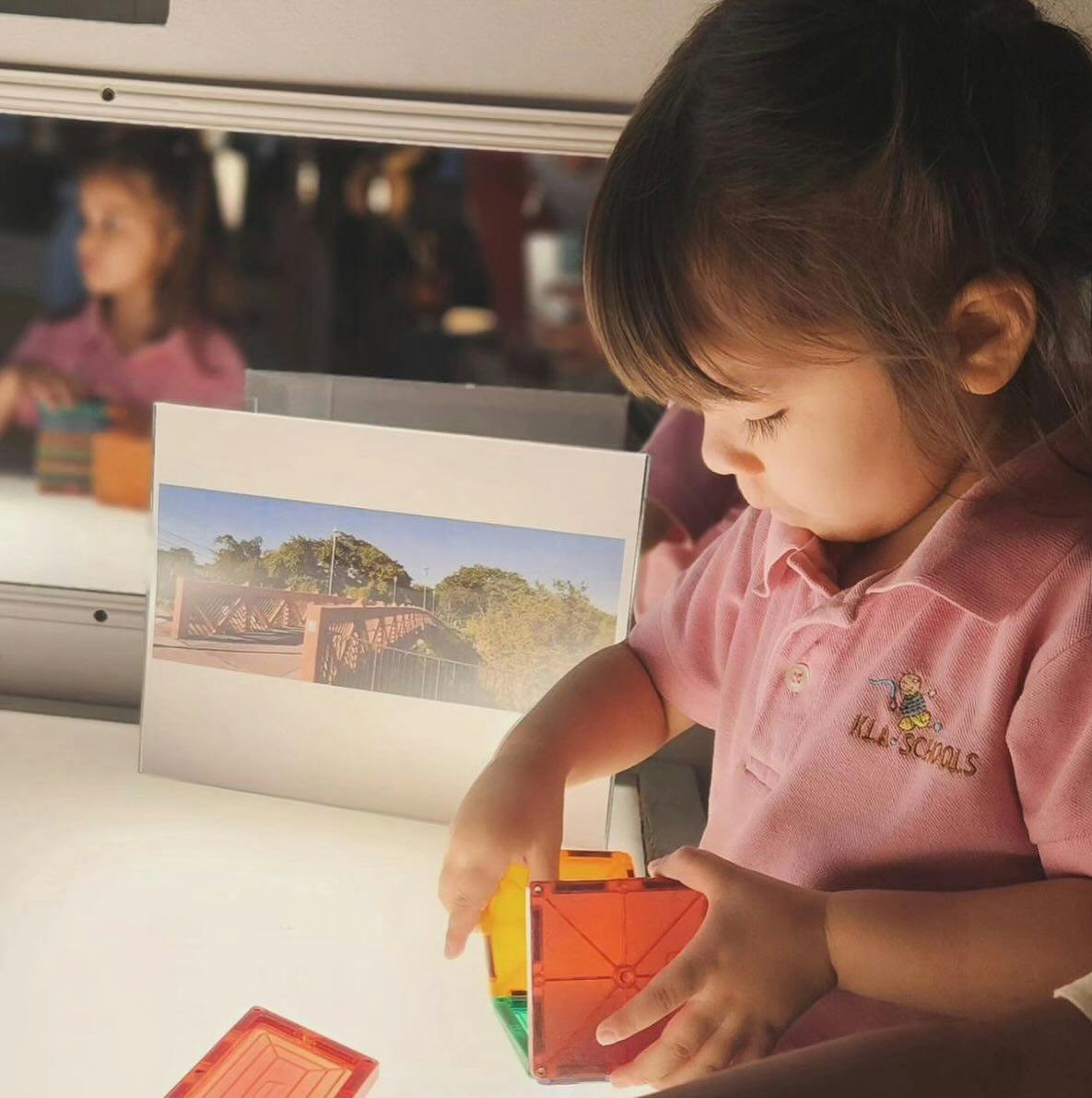 Child playing with colorful magnetic blocks