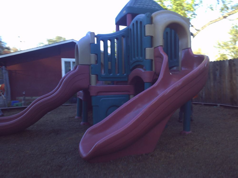 Playground structure with multiple slides