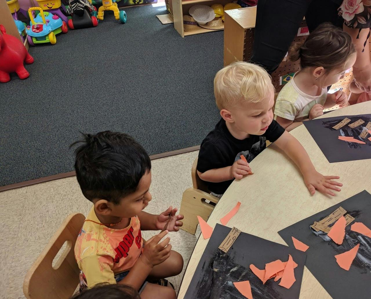 Children doing an art activity at a table