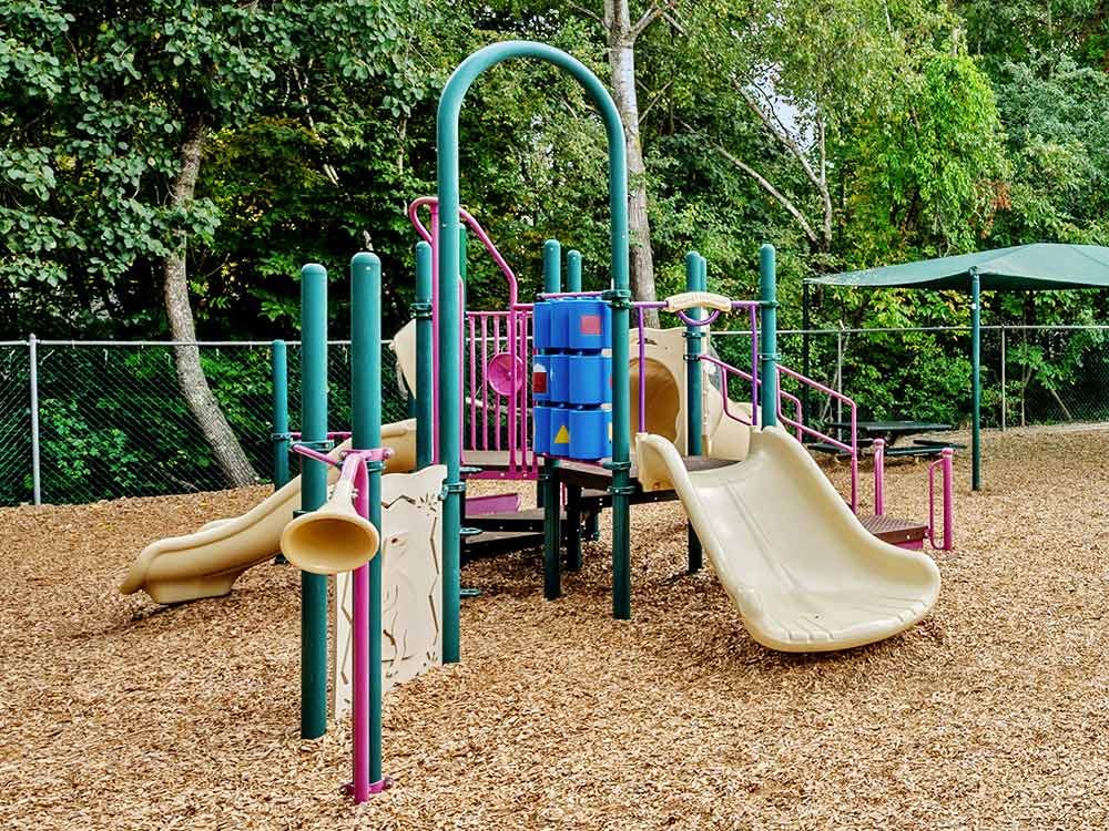 A colorful playground with slides and climbing structures