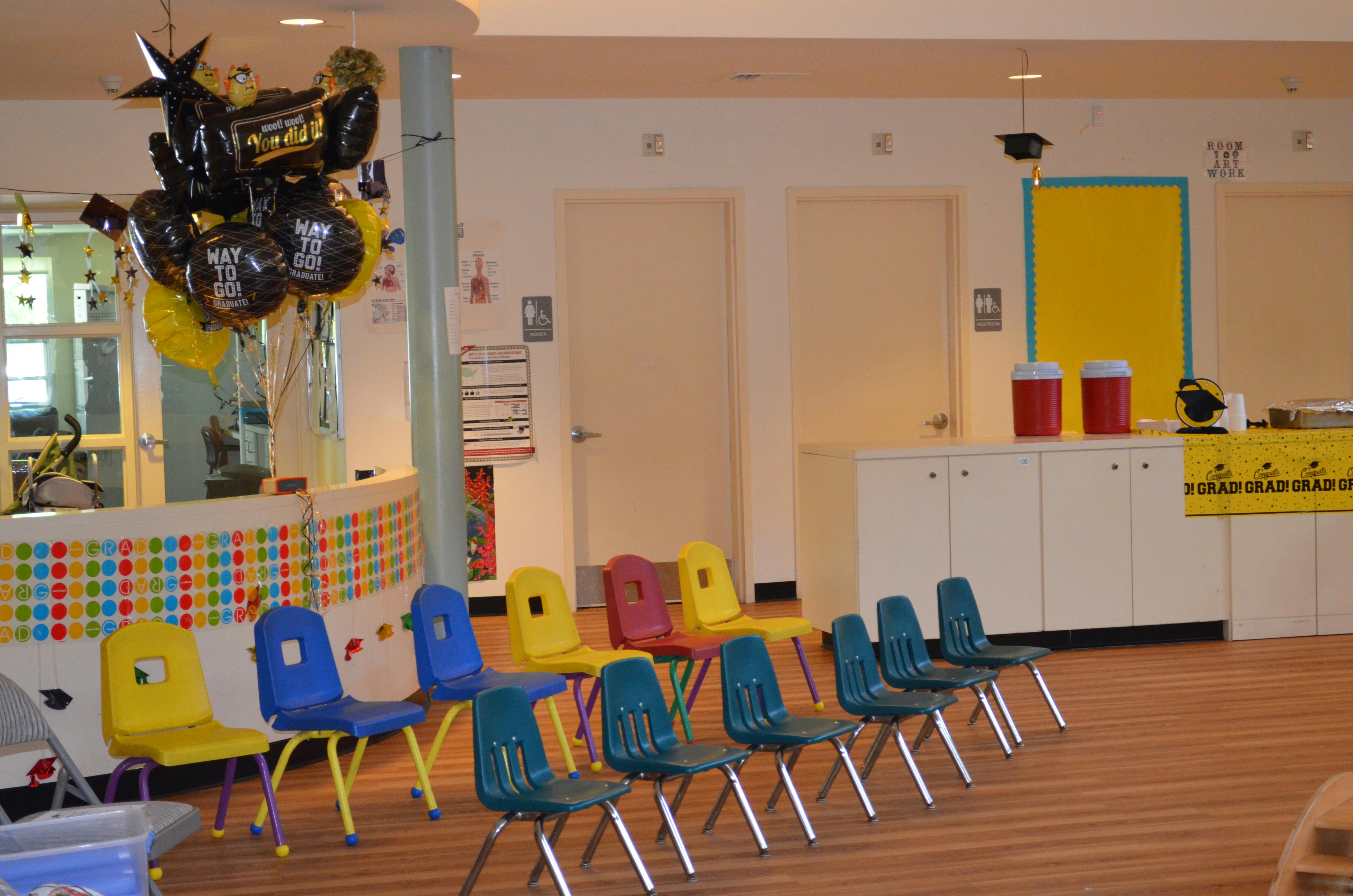 Colorful chairs arranged in rows in a room