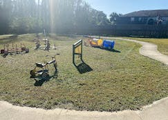 Outdoor playground with a walker and tunnel