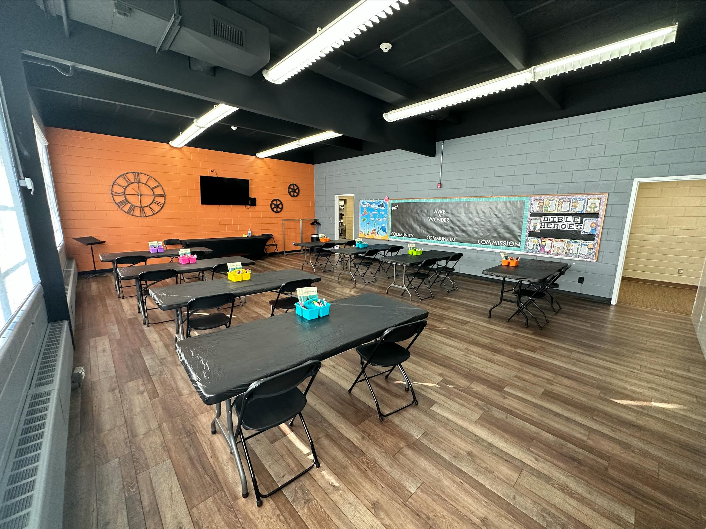Empty classroom with tables and chairs