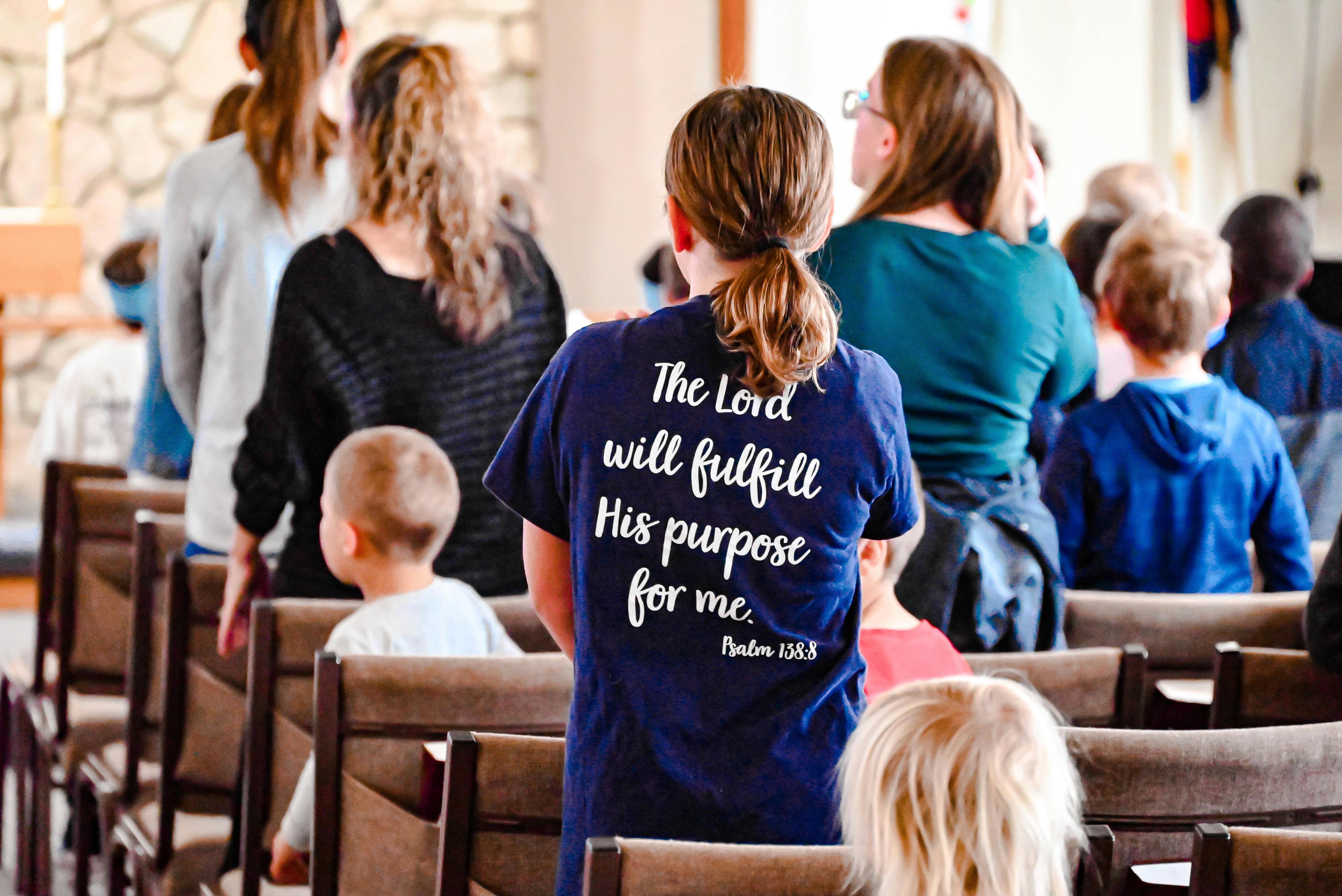 Person in blue shirt with text "The Lord will fulfill His purpose for me"