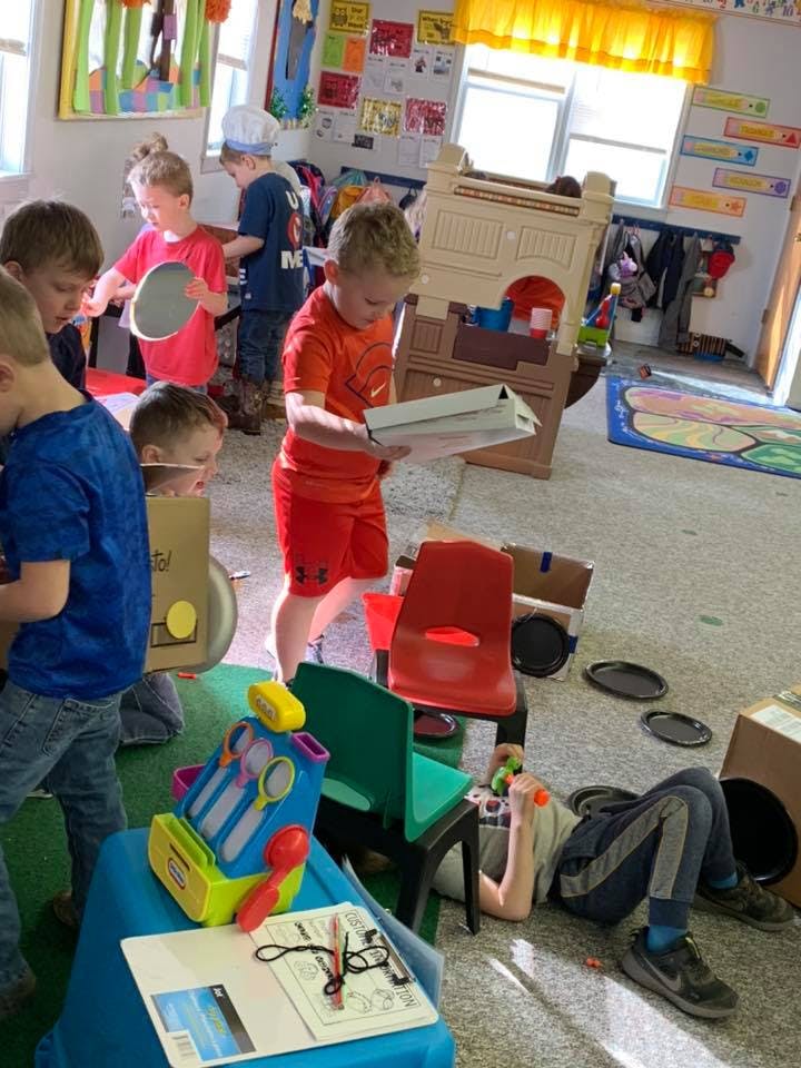 Children playing in a classroom