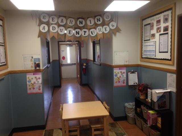 Hallway decorated with a banner that reads "Learning Adventures"