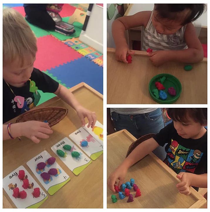 Children playing with colorful counting manipulatives and cards