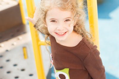 Child on playground equipment