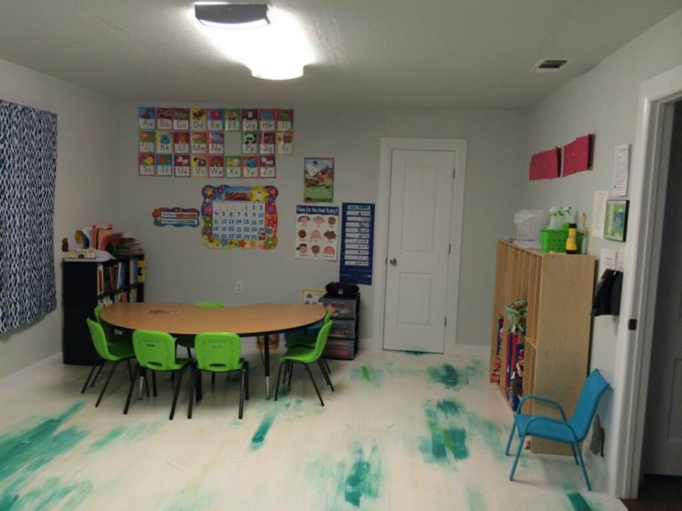 Classroom with green paint splattered on the floor