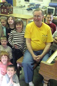 Adult and children in a classroom