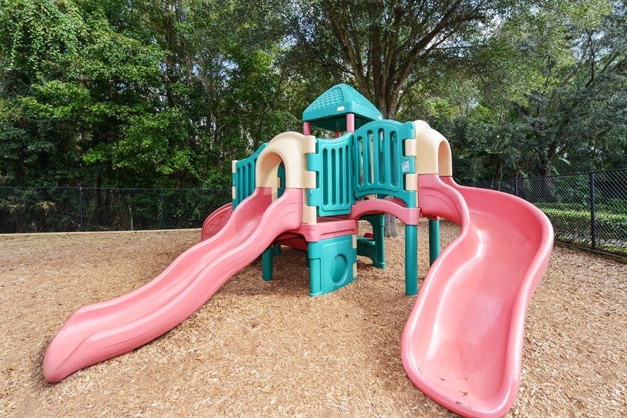 Playground structure with multiple slides