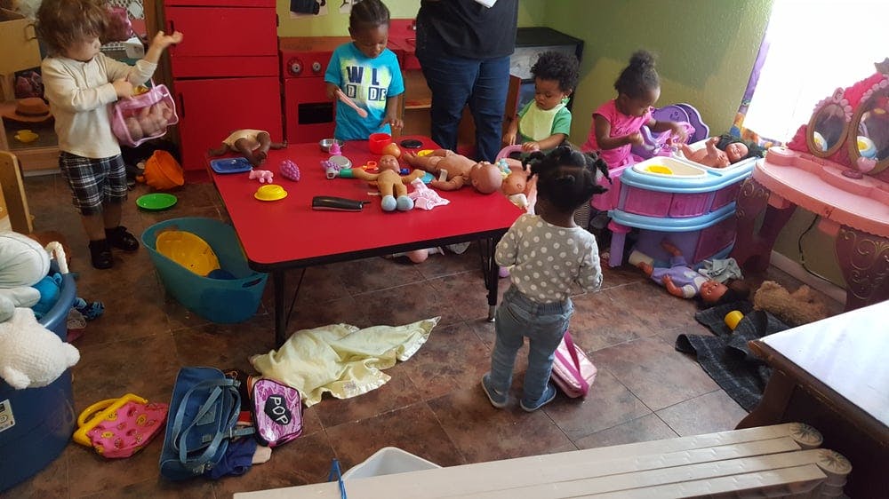 Children playing with toys in a room