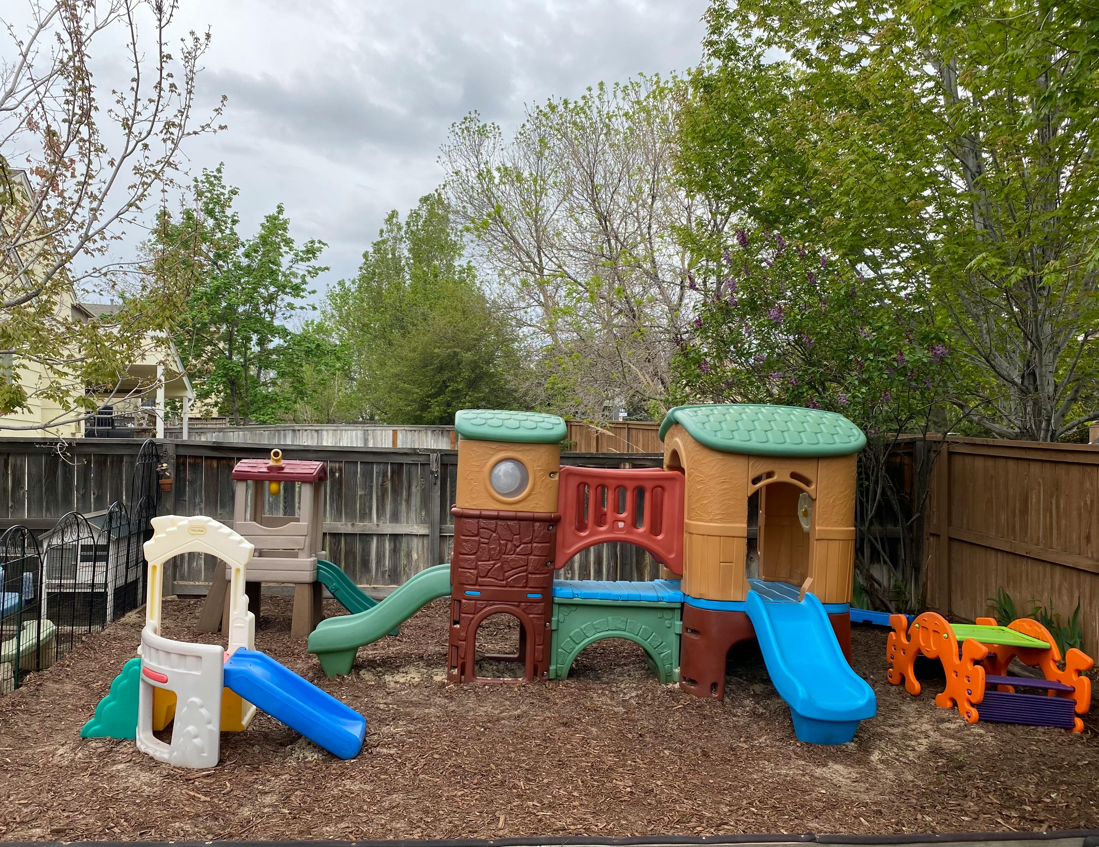 Outdoor playground with multiple slides and play structures