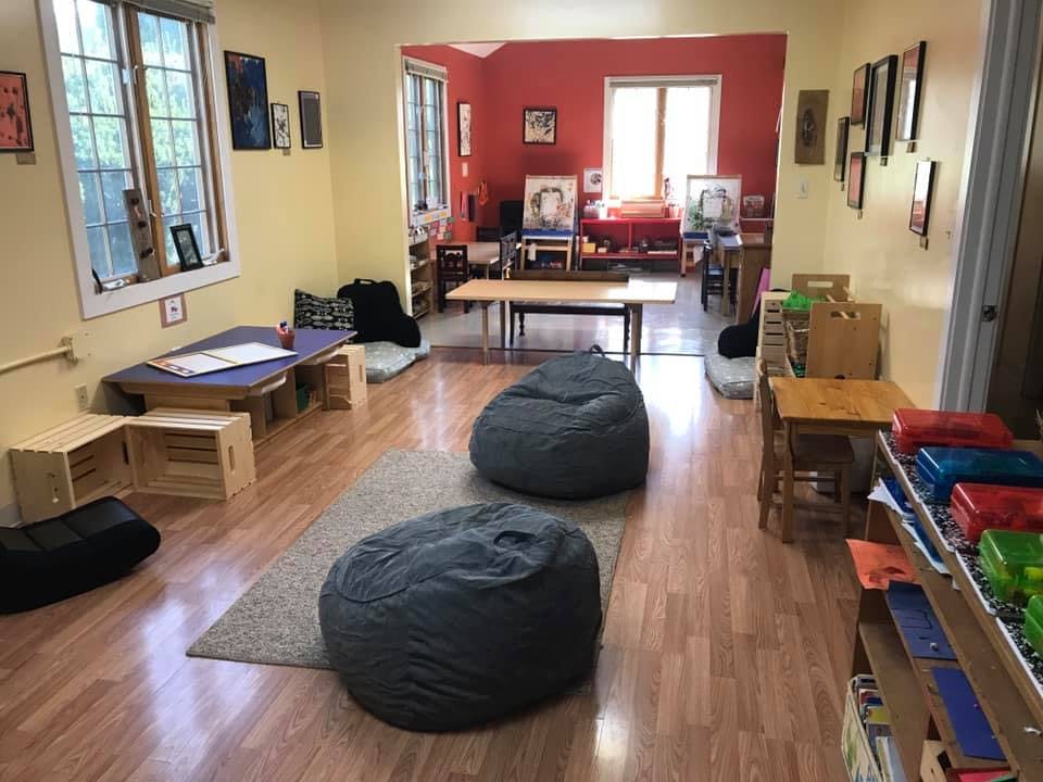 Classroom with beanbag chairs, tables, and windows
