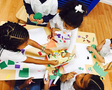 Children doing crafts at a table