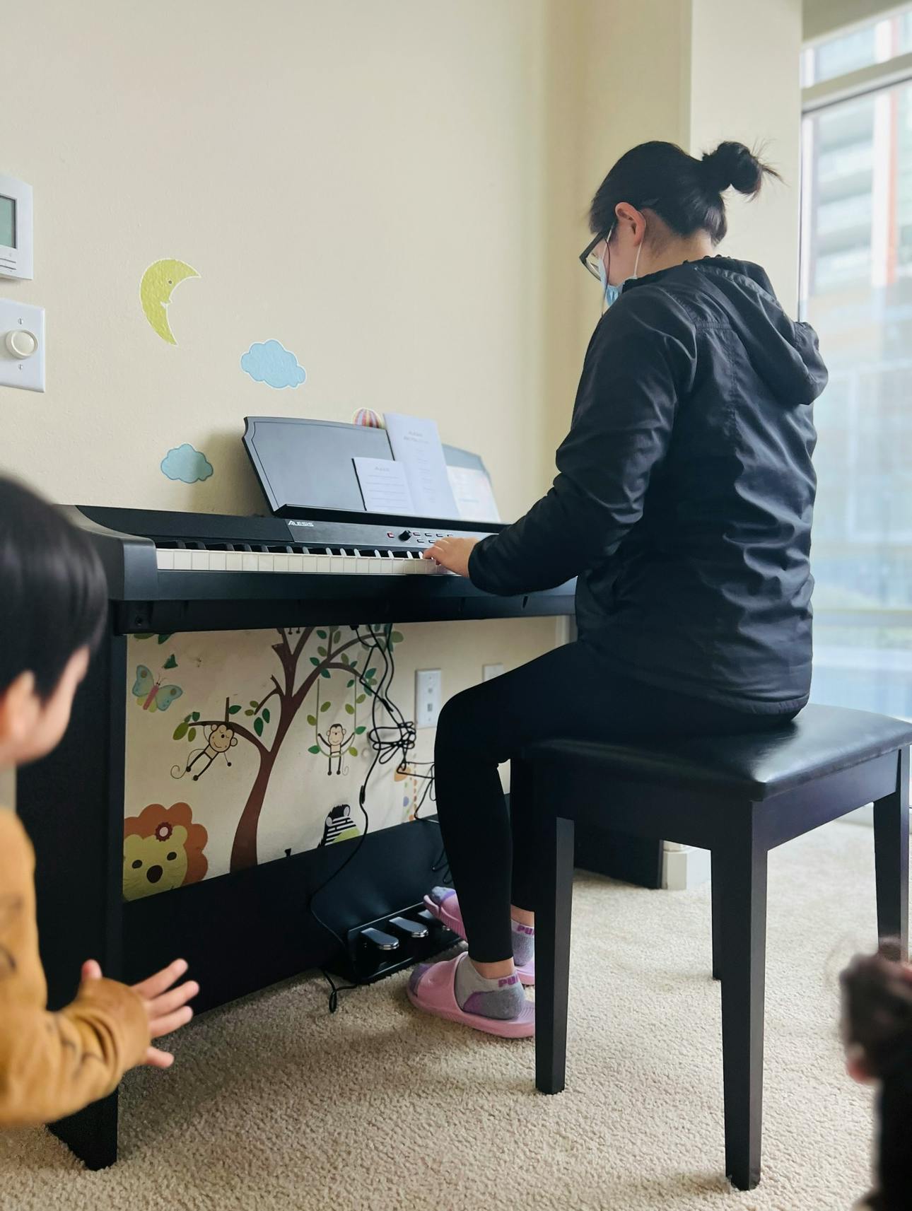 Person playing a digital piano