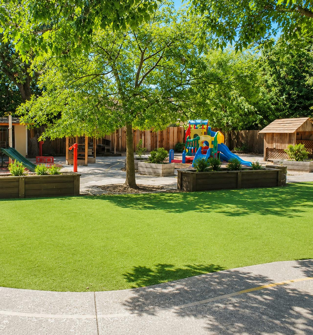 Playground with climbing structures, slides, and trees
