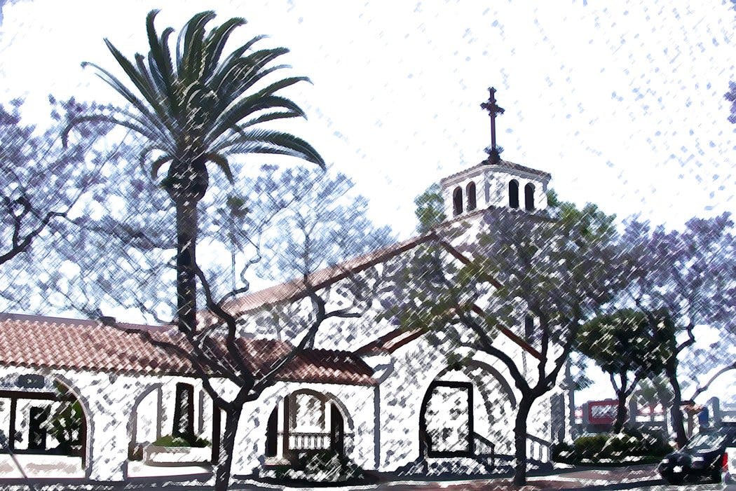 White building with arches and a bell tower with a cross, palm tree