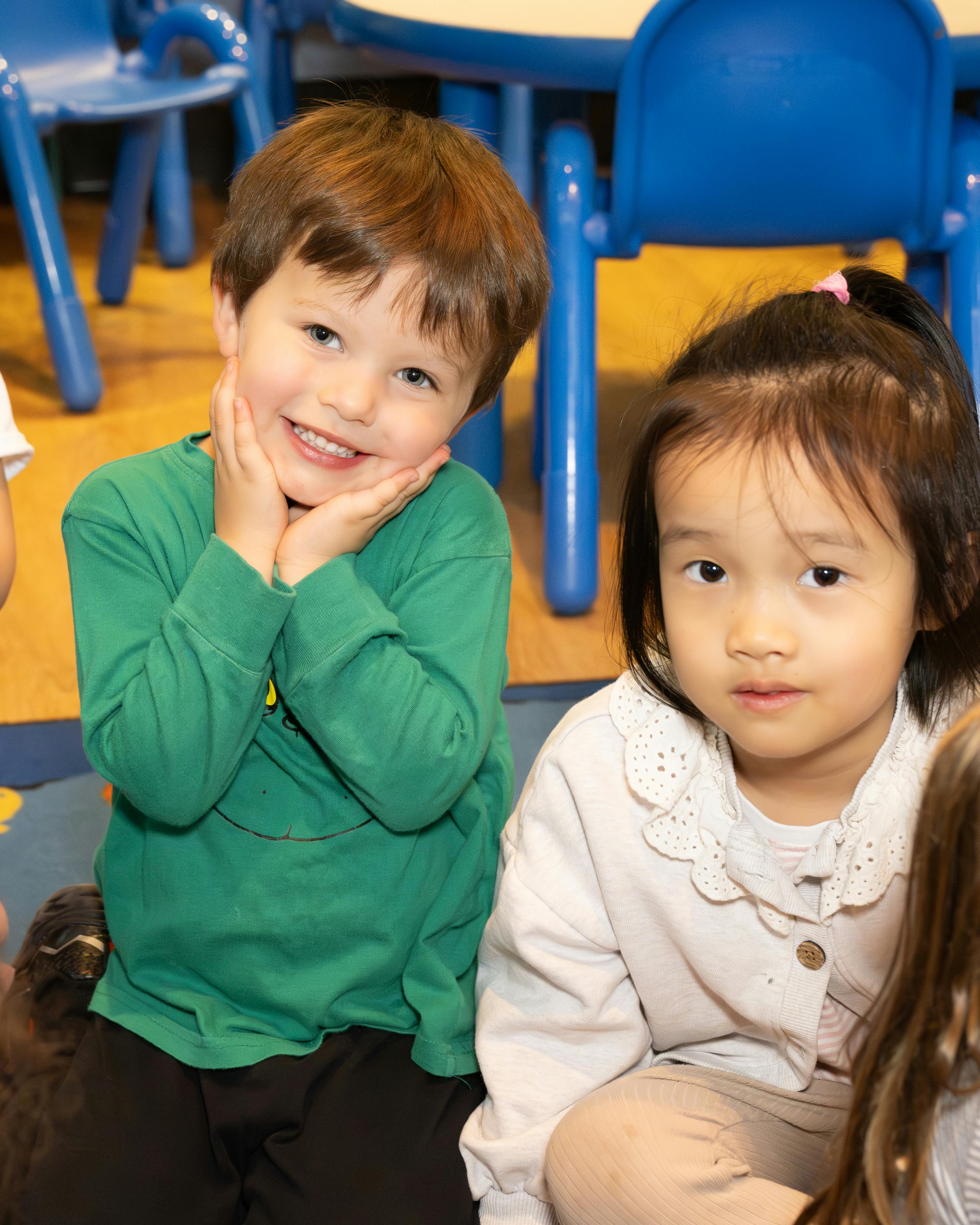 Two children sitting on the floor