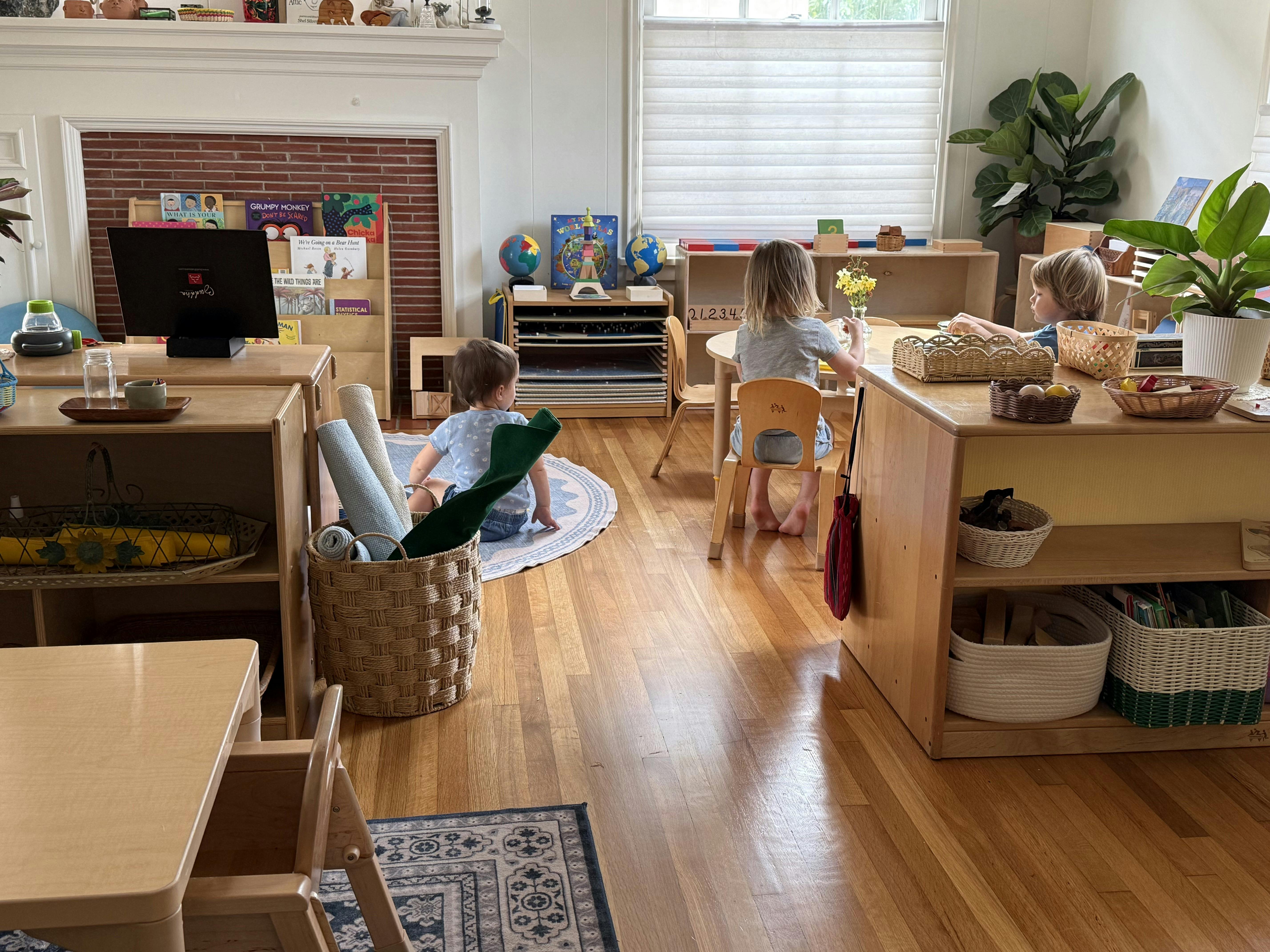 Children playing and working in a classroom