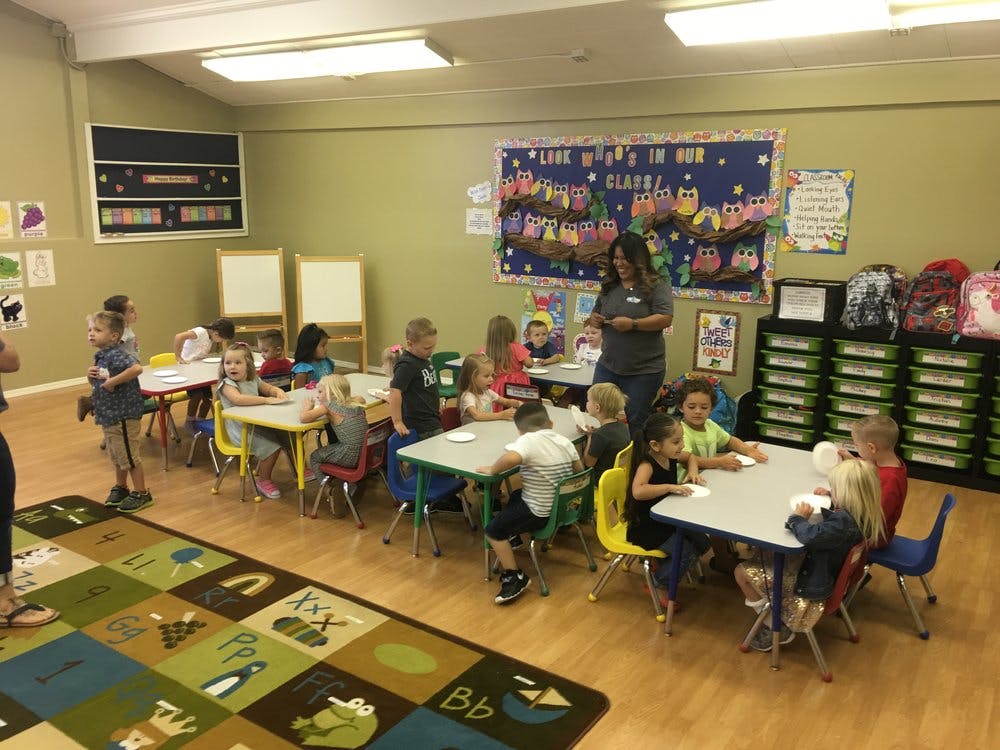 Adult and children in a classroom