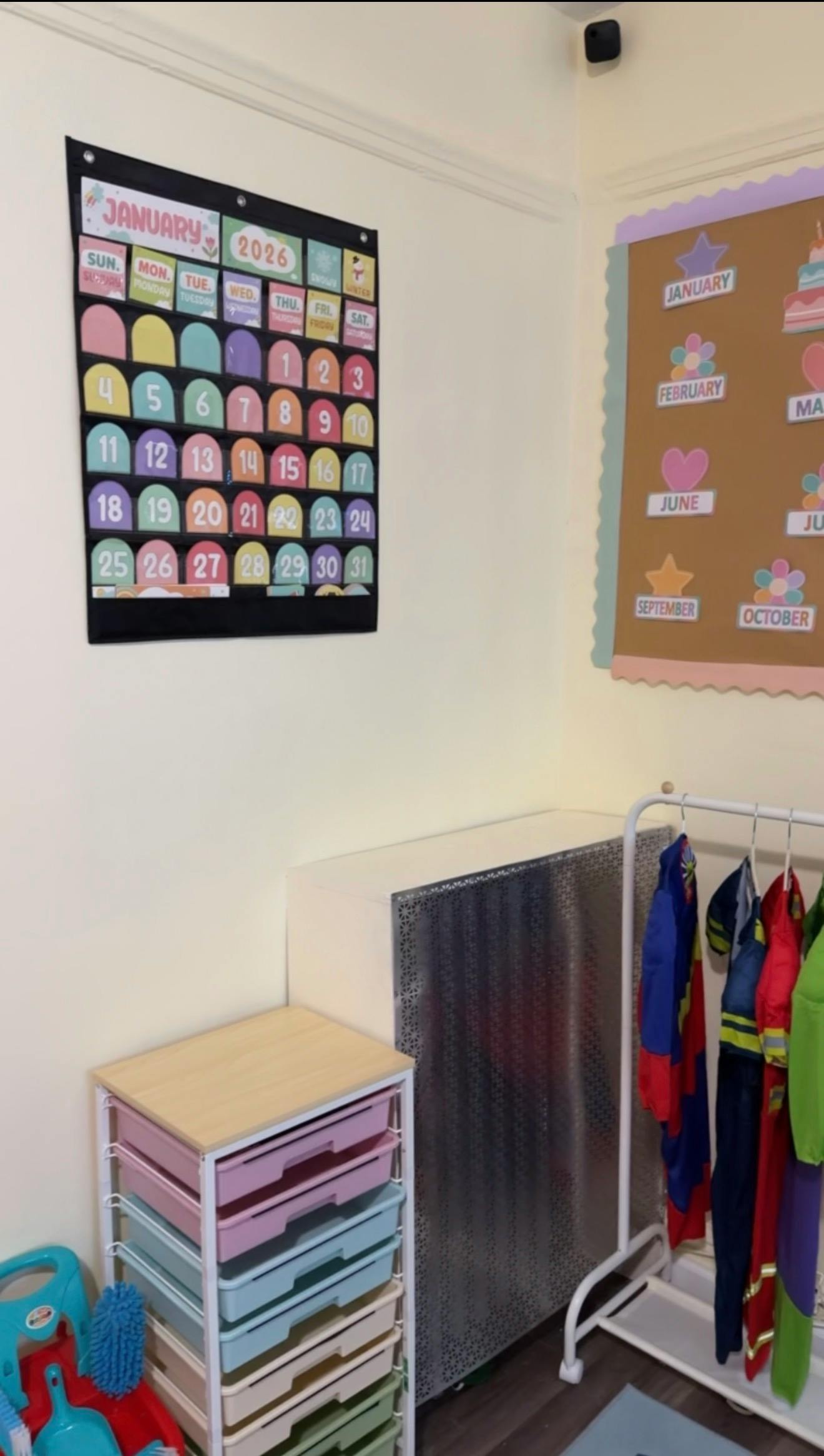 Classroom wall with a January 2026 calendar and a bulletin board
