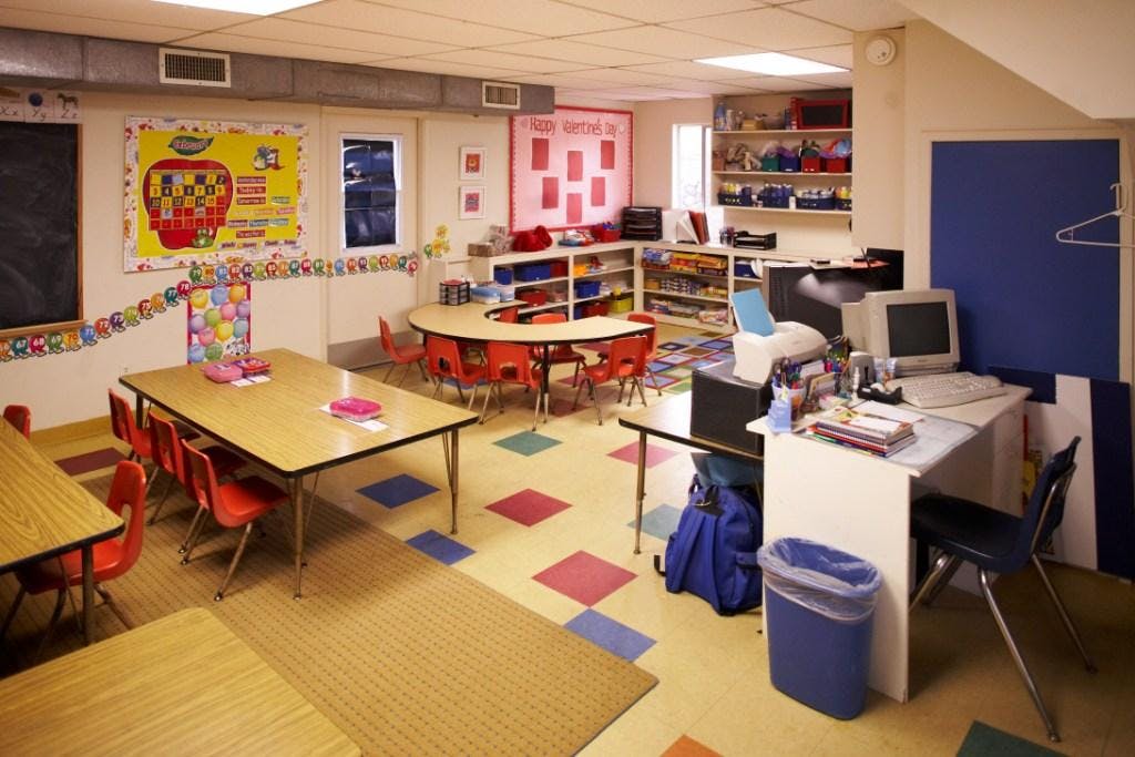 Classroom with tables, chairs, and learning materials