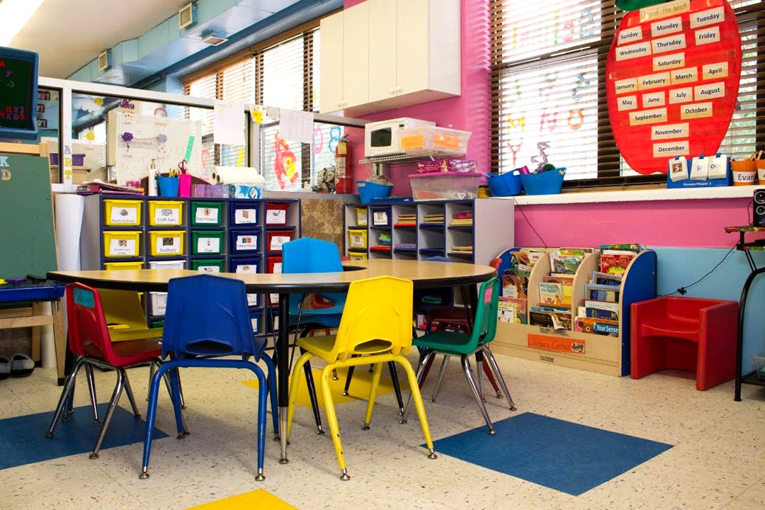 Classroom with small table and colorful chairs
