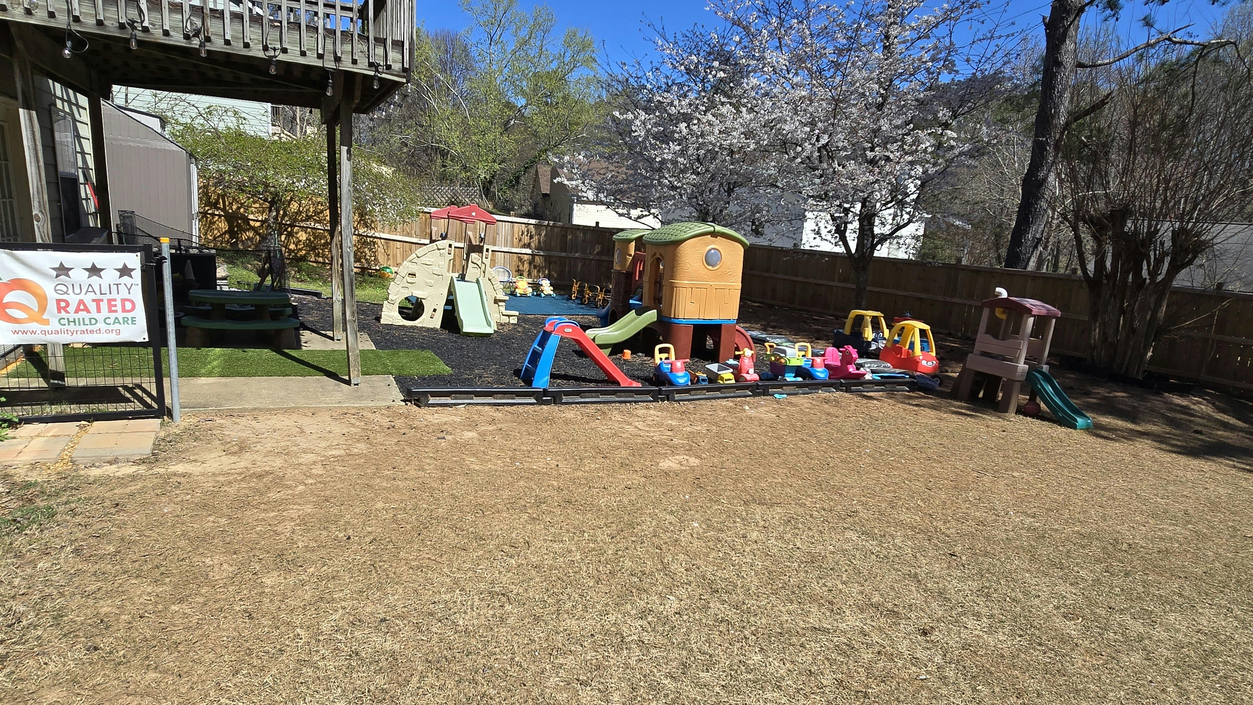 Outdoor playground with various colorful play structures and slides