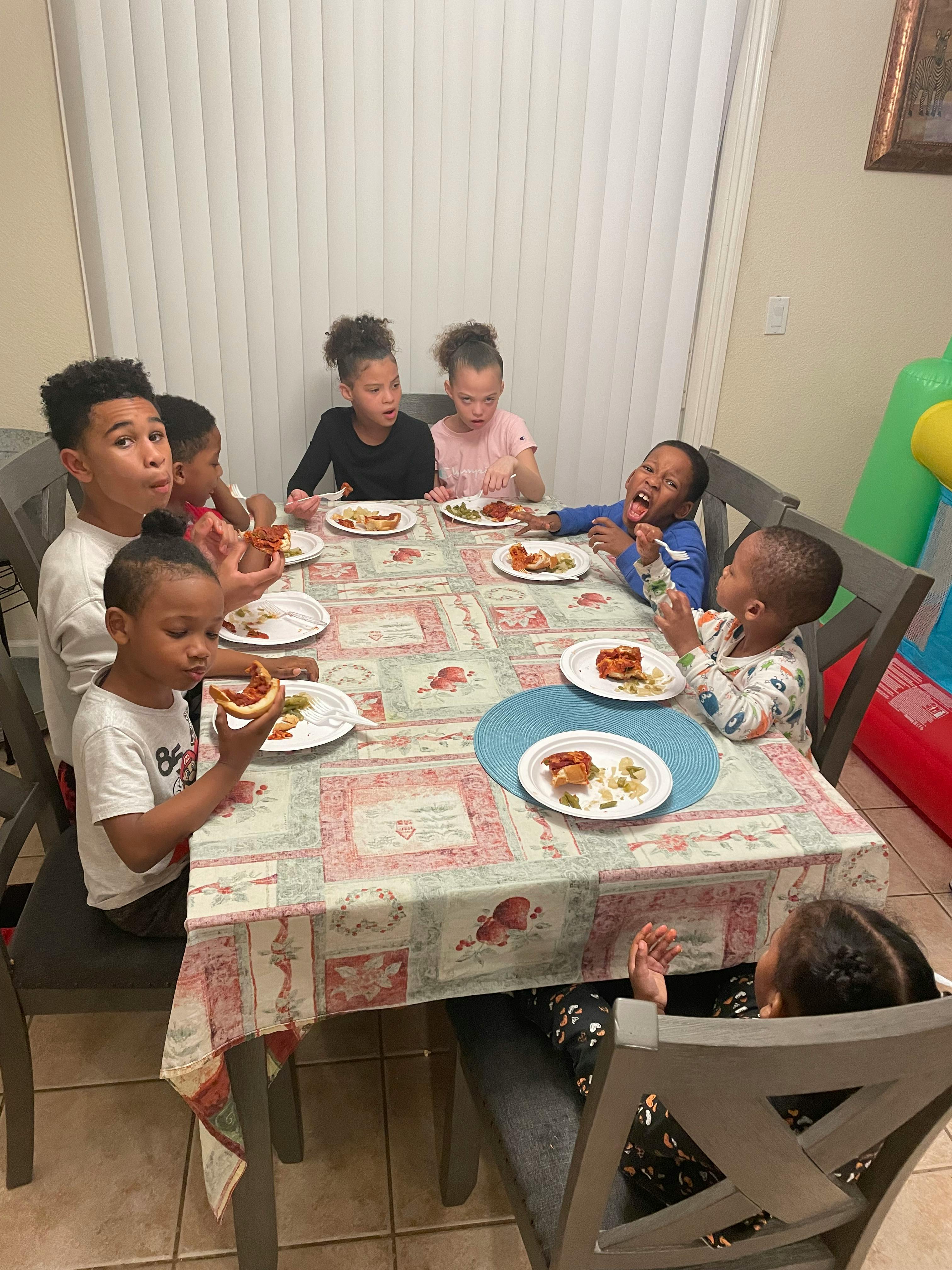 Group of children eating at a table