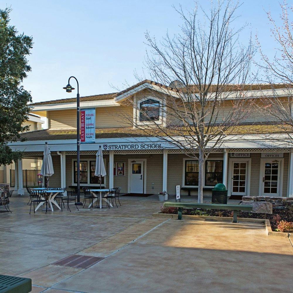 Building with a sign that reads "Stratford School"