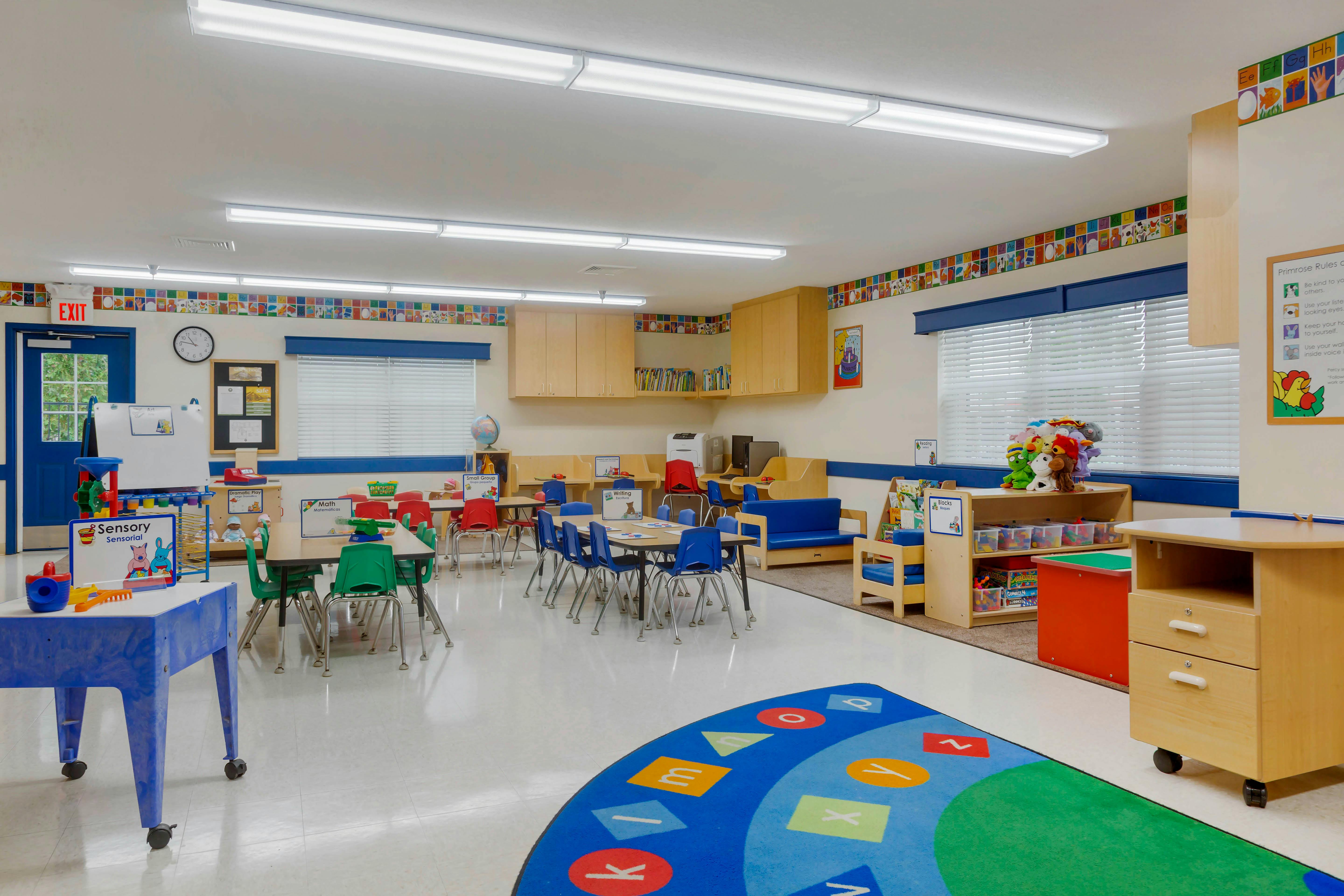 An empty early childhood classroom with multiple activity stations