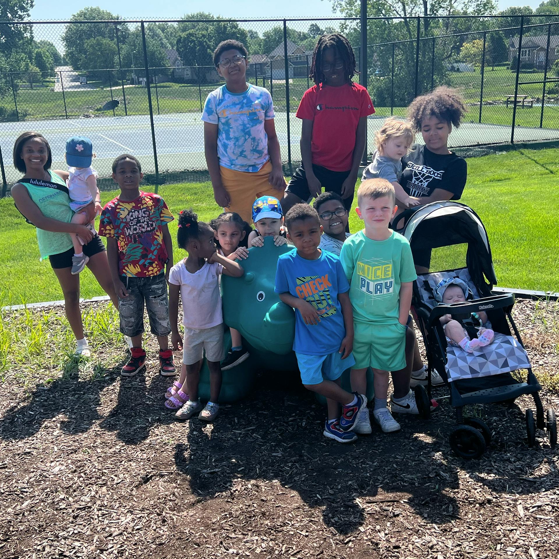 Group of children and teens posing outdoors