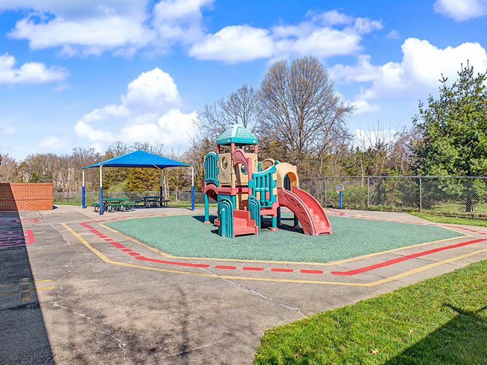 Playground with climbing structure and slide