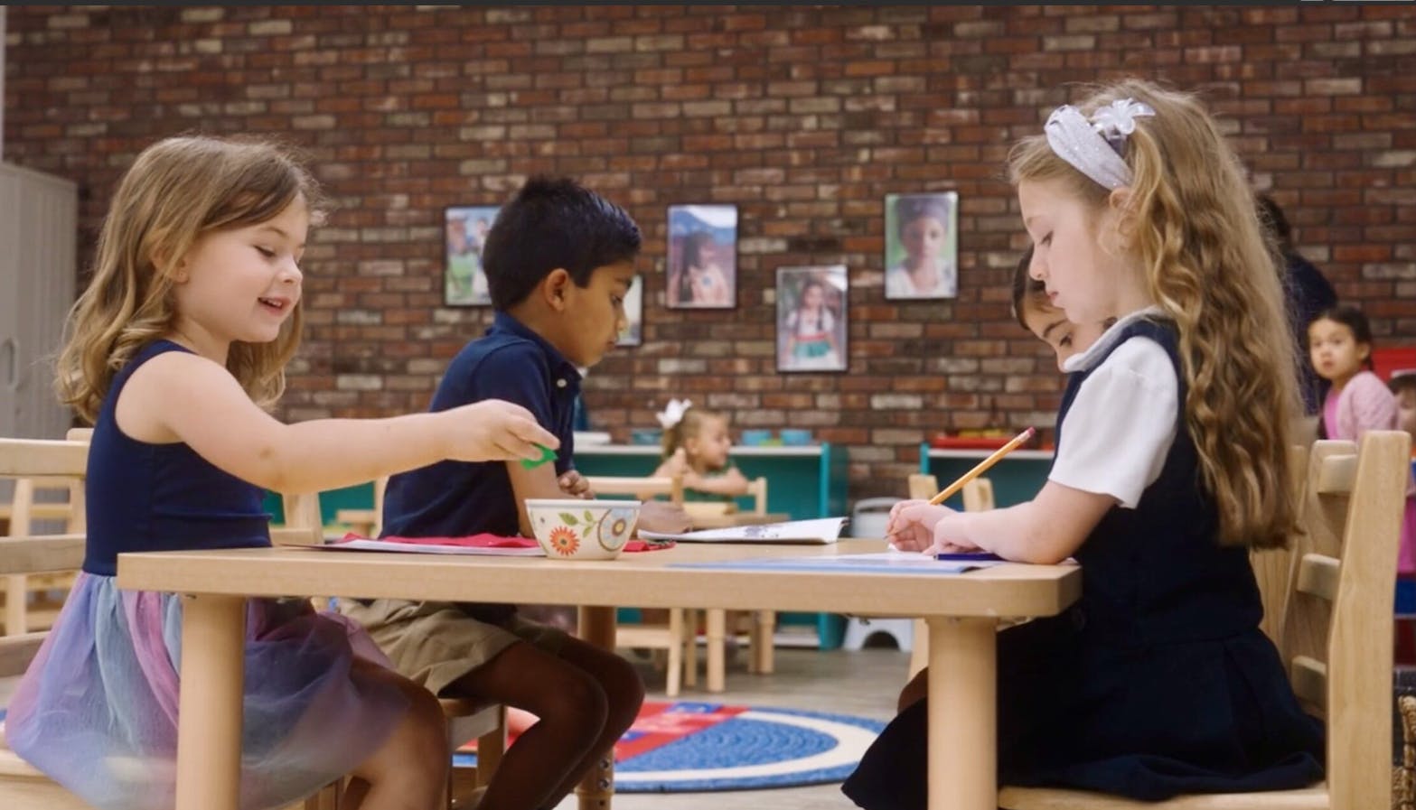 Children working on crafts at tables in a classroom