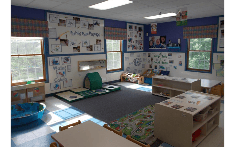 Children's activity room with artwork on walls and play equipment