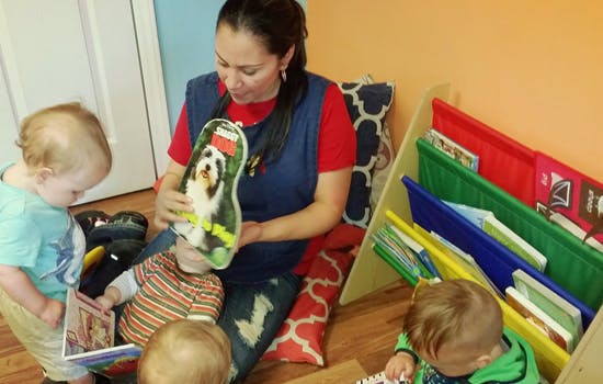 Person reading to children in a classroom