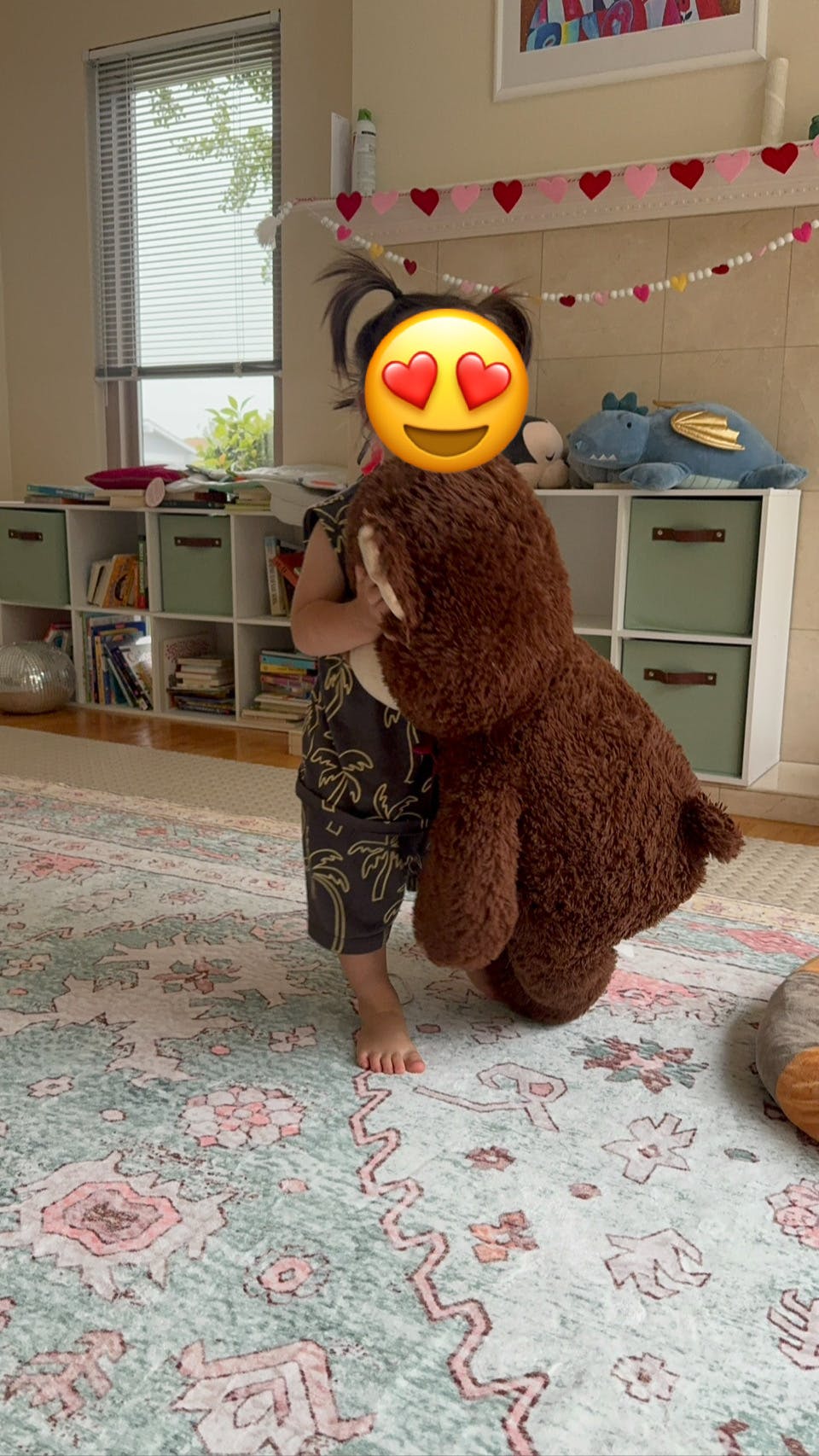 Child holding a large stuffed animal